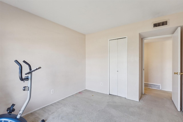 unfurnished bedroom with light colored carpet