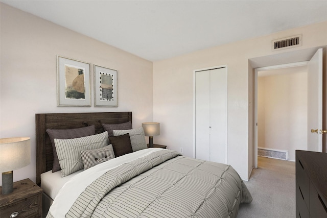 bedroom with light carpet and a closet