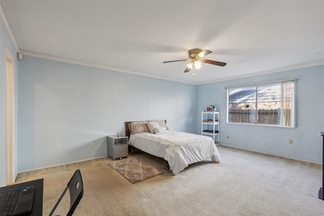 bedroom with ceiling fan, crown molding, and light carpet