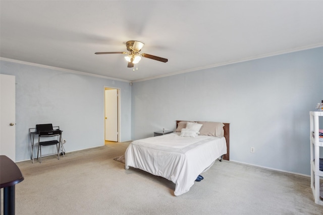 carpeted bedroom featuring ceiling fan and ornamental molding