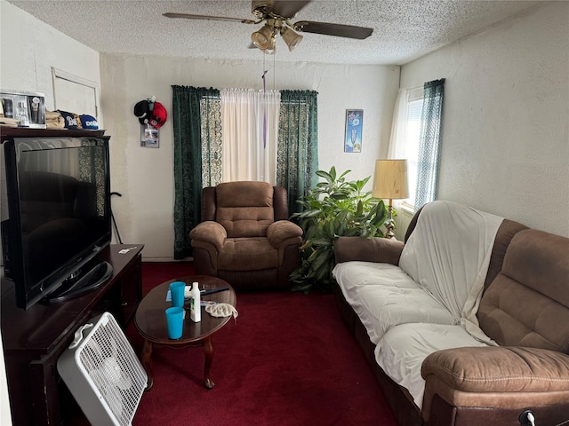 living room with carpet flooring, ceiling fan, and a textured ceiling