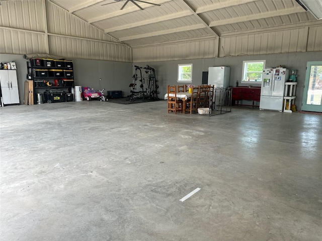 garage with white fridge and white fridge with ice dispenser