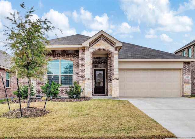 view of front of home with a garage and a front yard