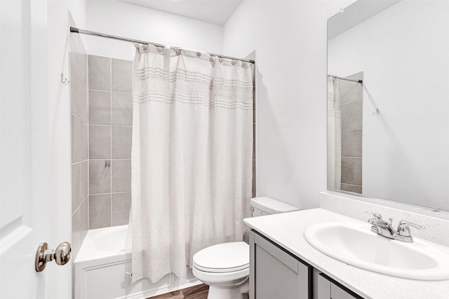 full bathroom with vanity, toilet, and shower / bath combo with shower curtain