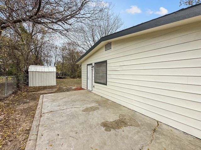 view of patio / terrace featuring a shed