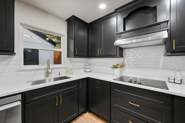 kitchen with black electric stovetop, decorative backsplash, and sink