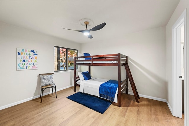 bedroom featuring hardwood / wood-style flooring and ceiling fan