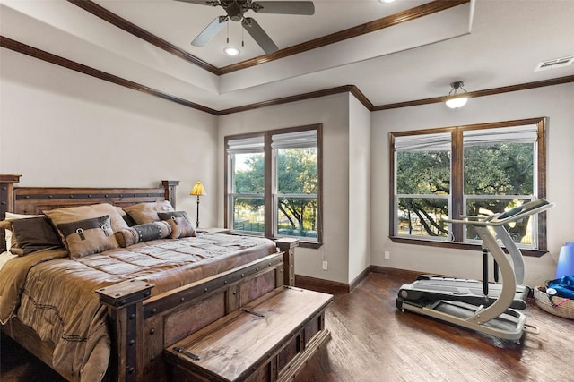 bedroom featuring ornamental molding, ceiling fan, and dark wood-type flooring