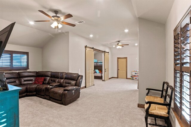 living room featuring light carpet, ceiling fan, and vaulted ceiling