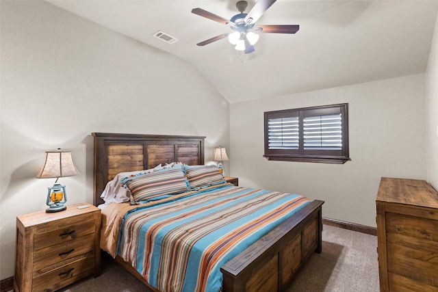 bedroom with dark colored carpet, ceiling fan, and vaulted ceiling