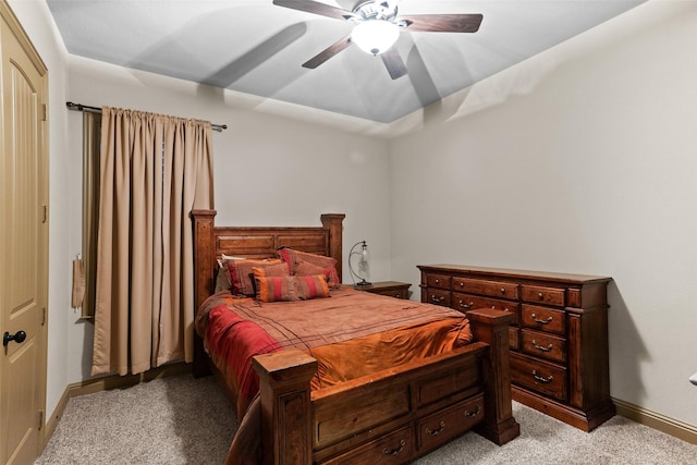 bedroom with light carpet and ceiling fan