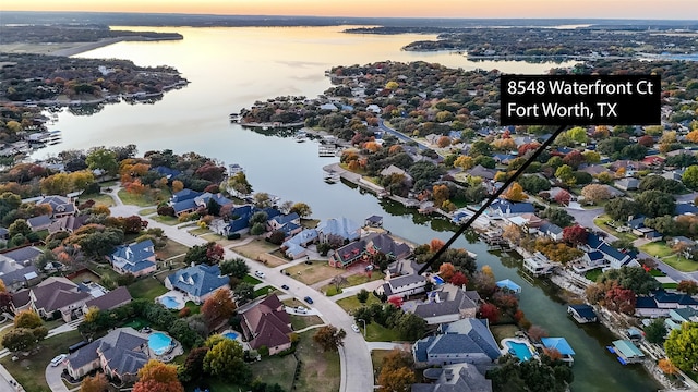 aerial view at dusk with a water view