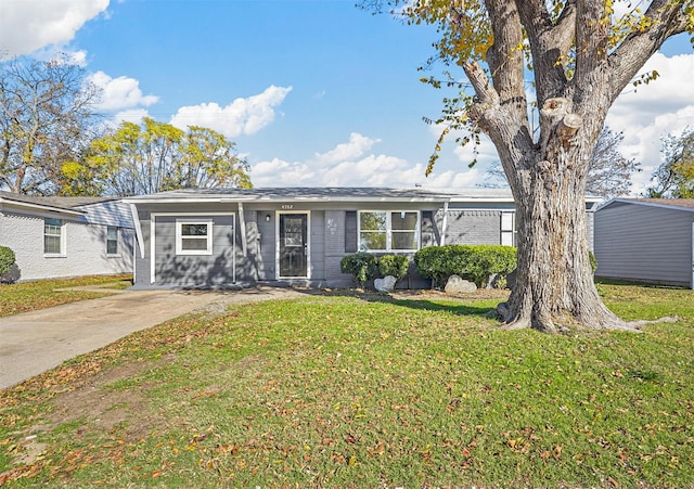 ranch-style house with a front lawn