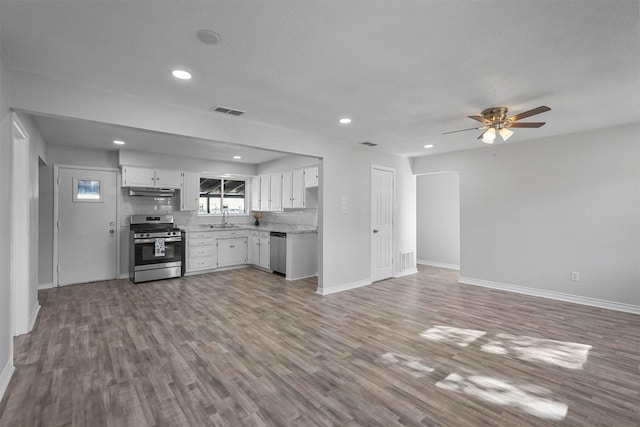 kitchen with ceiling fan, sink, light hardwood / wood-style floors, white cabinets, and appliances with stainless steel finishes