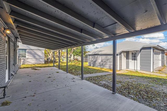 view of patio / terrace featuring a storage shed