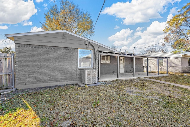 exterior space featuring central AC unit and a patio area