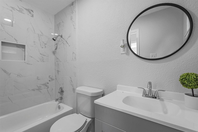 full bathroom with toilet, vanity, and tiled shower / bath combo