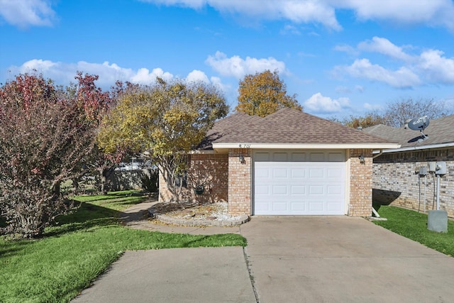 view of side of home featuring a lawn and a garage