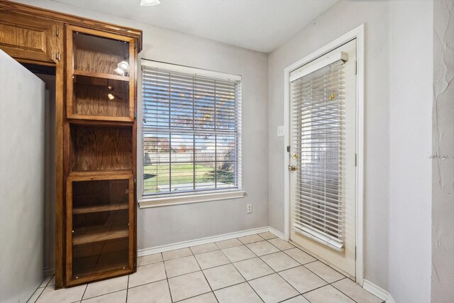 entryway featuring light tile patterned flooring