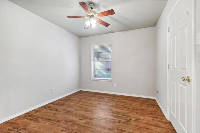 unfurnished room featuring dark hardwood / wood-style floors and ceiling fan