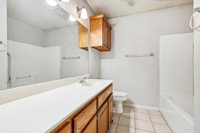 full bathroom with tile patterned floors, vanity, toilet, and washtub / shower combination