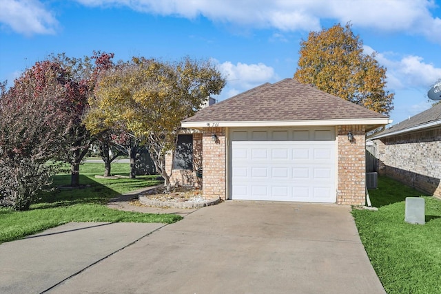 view of front of home featuring a garage and a front lawn