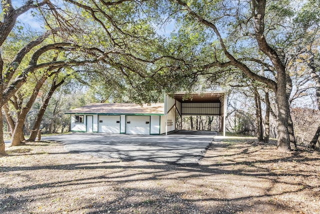 exterior space featuring a garage and a carport