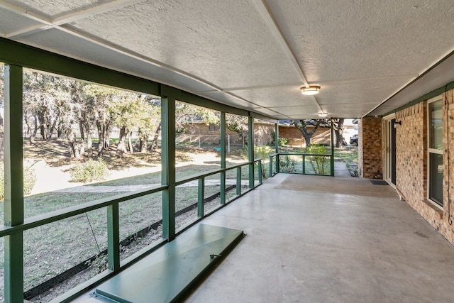 unfurnished sunroom with a wealth of natural light