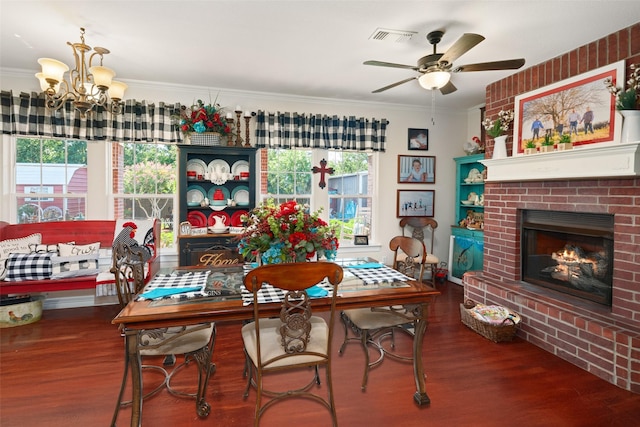 510 N Mcclendon St, Leonard, TX 75452 - dining room with wood finished floors, a chandelier, a fireplace, a ceiling fan, and crown molding