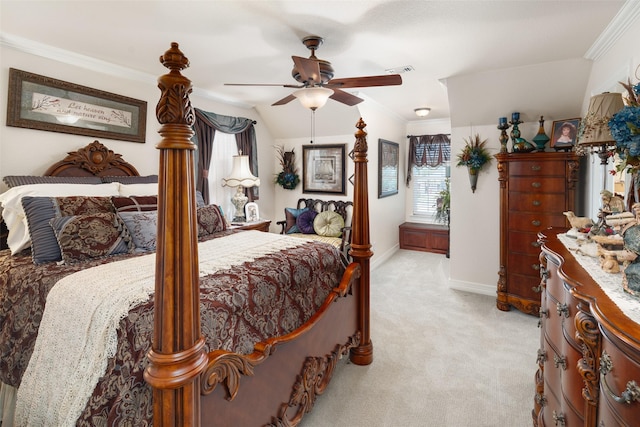 carpeted bedroom with ceiling fan, crown molding, and vaulted ceiling