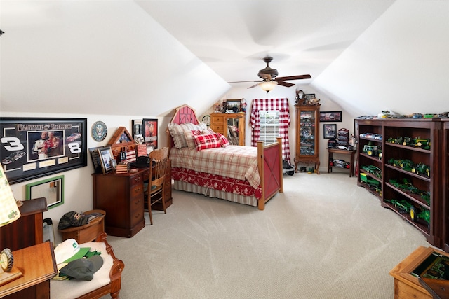 carpeted bedroom featuring vaulted ceiling and ceiling fan