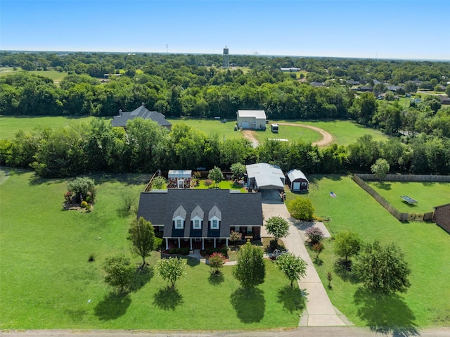 510 N Mcclendon St, Leonard, TX 75452 - view of subject property with a tree filled landscape