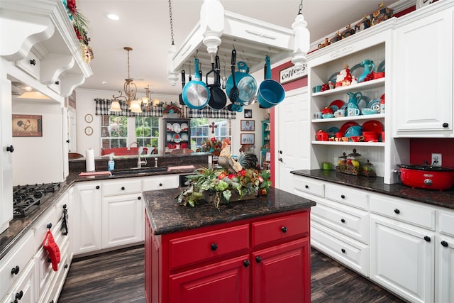 510 N Mcclendon St, Leonard, TX 75452 - kitchen featuring black gas cooktop, open shelves, a chandelier, crown molding, and dark wood-style flooring