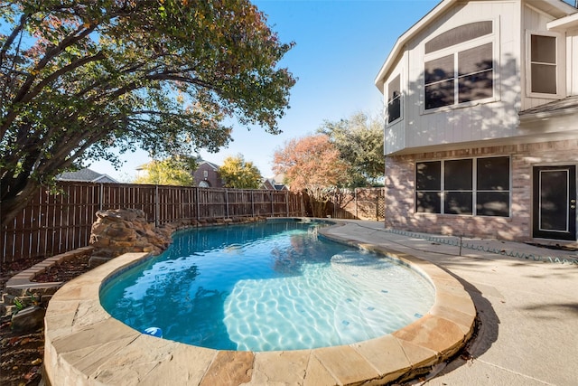 view of swimming pool with a patio