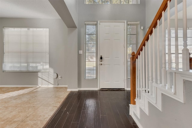 foyer with a healthy amount of sunlight and wood-type flooring