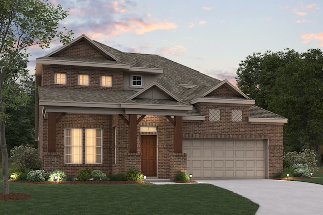 view of front facade featuring a lawn and a garage