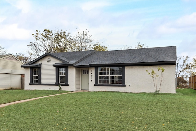 single story home featuring a front yard