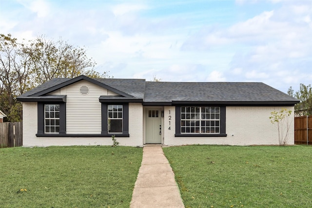 ranch-style home with a front lawn