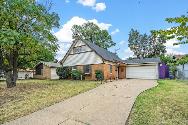 view of front of house with a garage and a front lawn