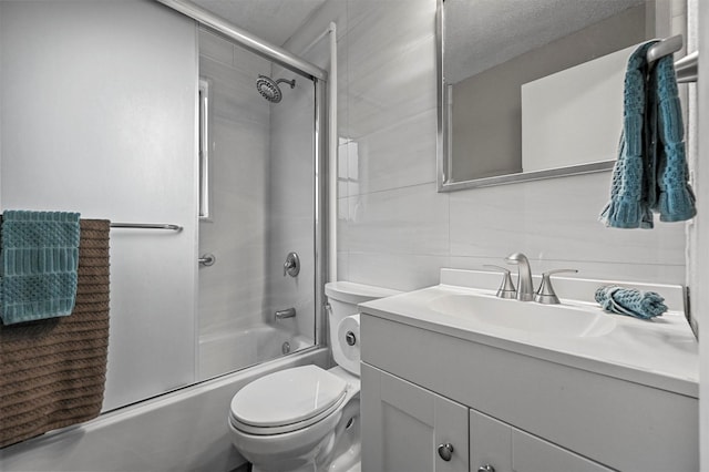 full bathroom with toilet, combined bath / shower with glass door, and vanity