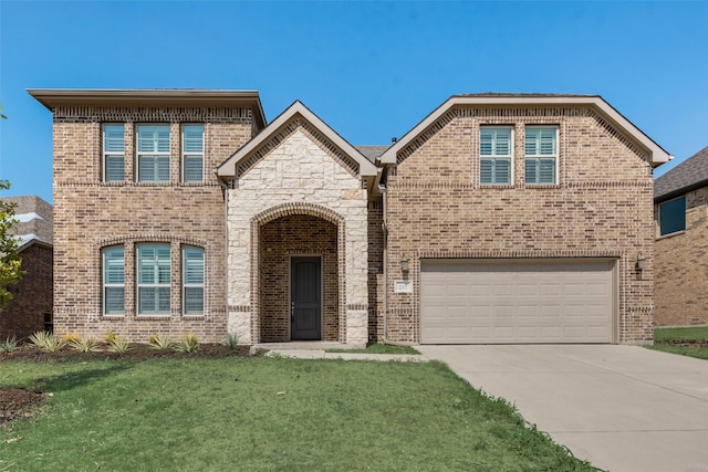 front of property with a front yard and a garage