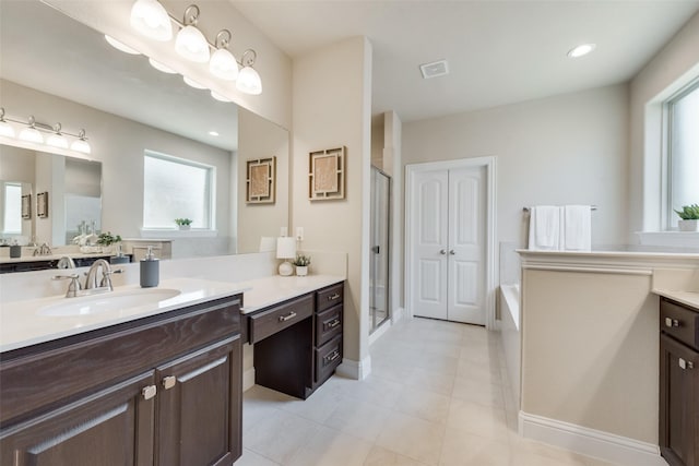 bathroom featuring vanity and an enclosed shower