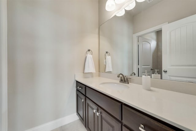 bathroom featuring tile patterned flooring and vanity