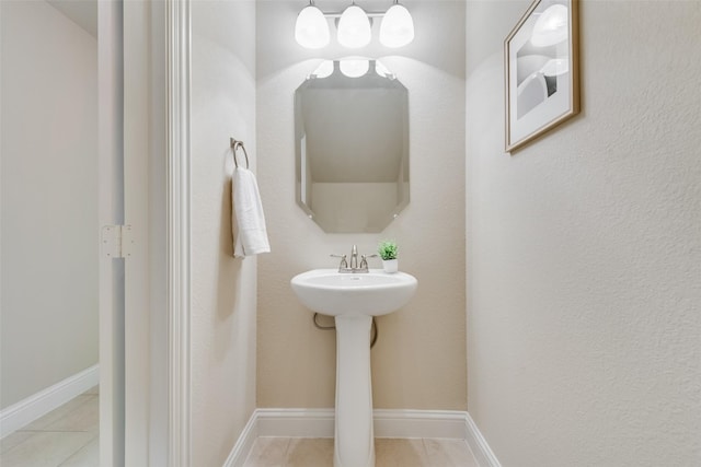 bathroom with tile patterned flooring and sink