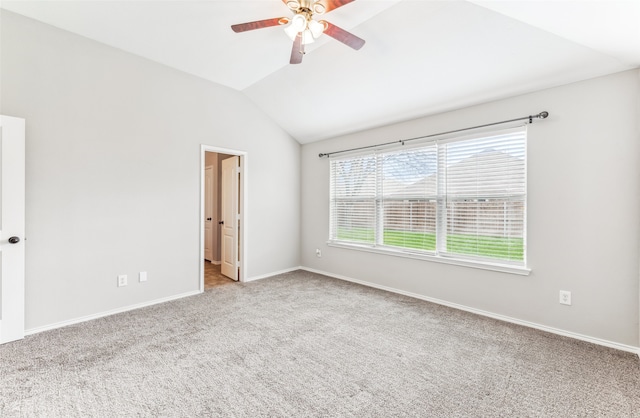 carpeted empty room featuring ceiling fan and lofted ceiling