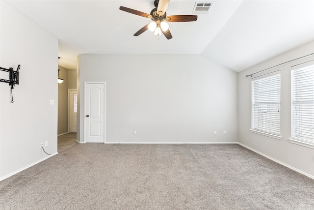 carpeted empty room featuring ceiling fan and lofted ceiling