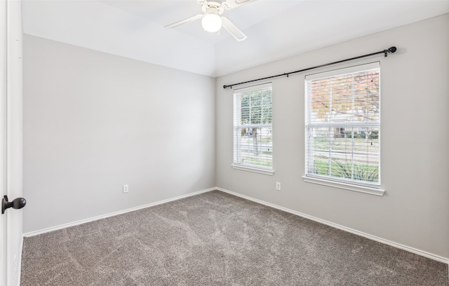 unfurnished room with ceiling fan and carpet floors