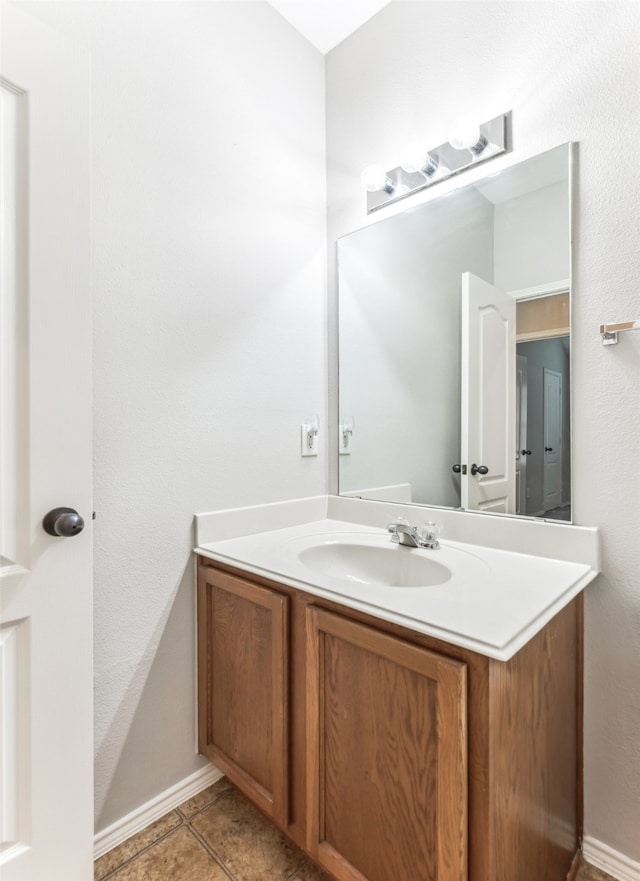 bathroom with vanity and tile patterned floors