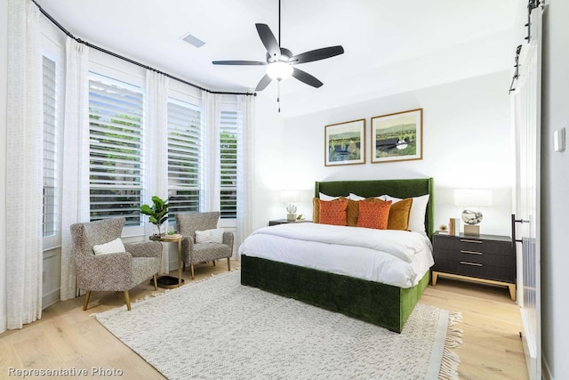 bedroom featuring light wood-type flooring and ceiling fan