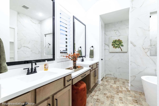 bathroom featuring vanity, shower with separate bathtub, and tile walls